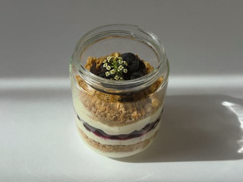Blueberry and white chocolate cheesecake dessert.
