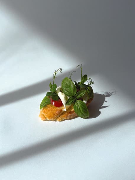 Caprese canapé on the current toasted baguette base.