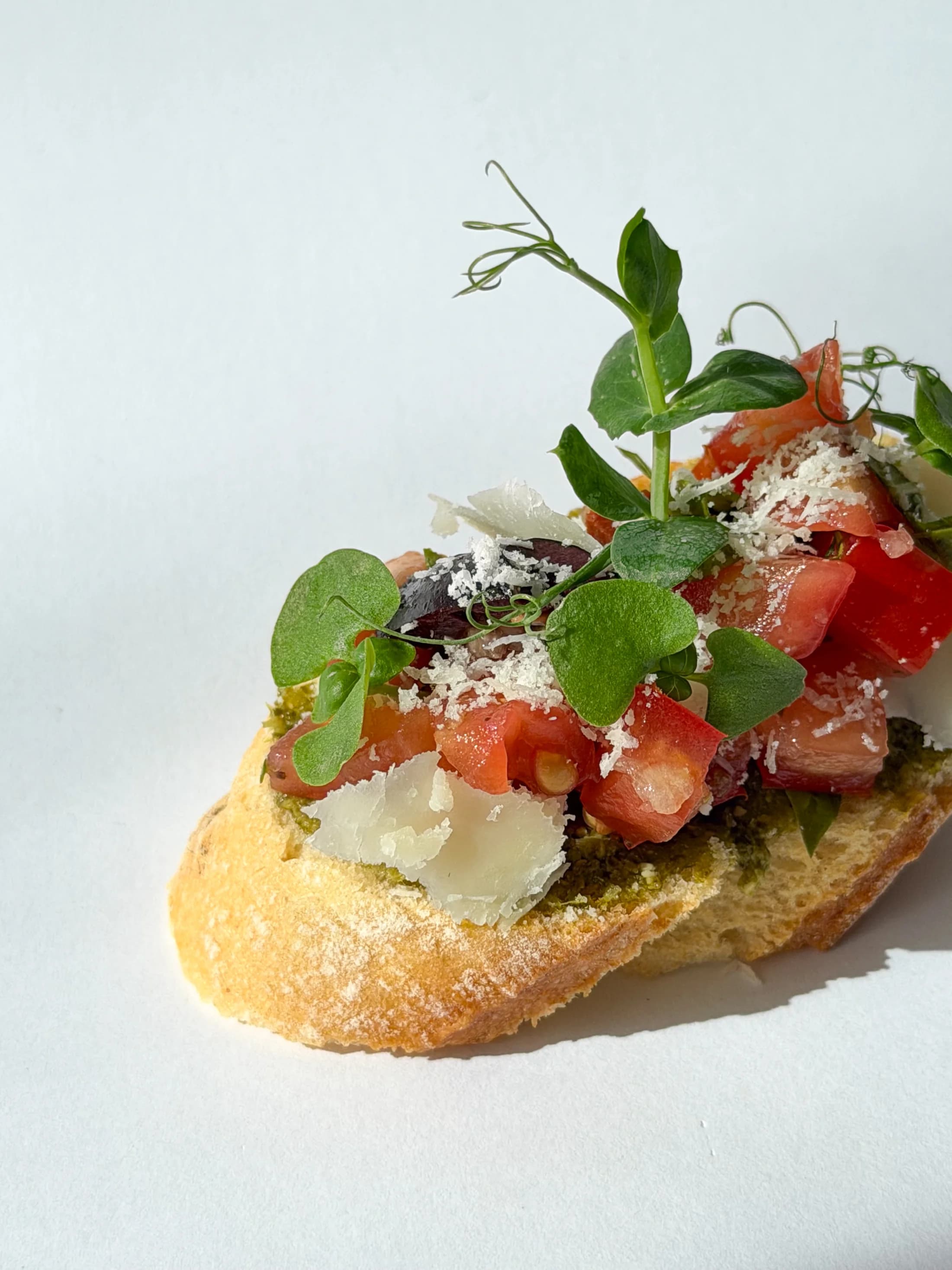 Close view of a current Canapés bruschetta on the standard baguette base.