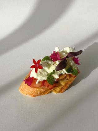 Mozzarella Bufala Peach canapé on toasted baguette.
